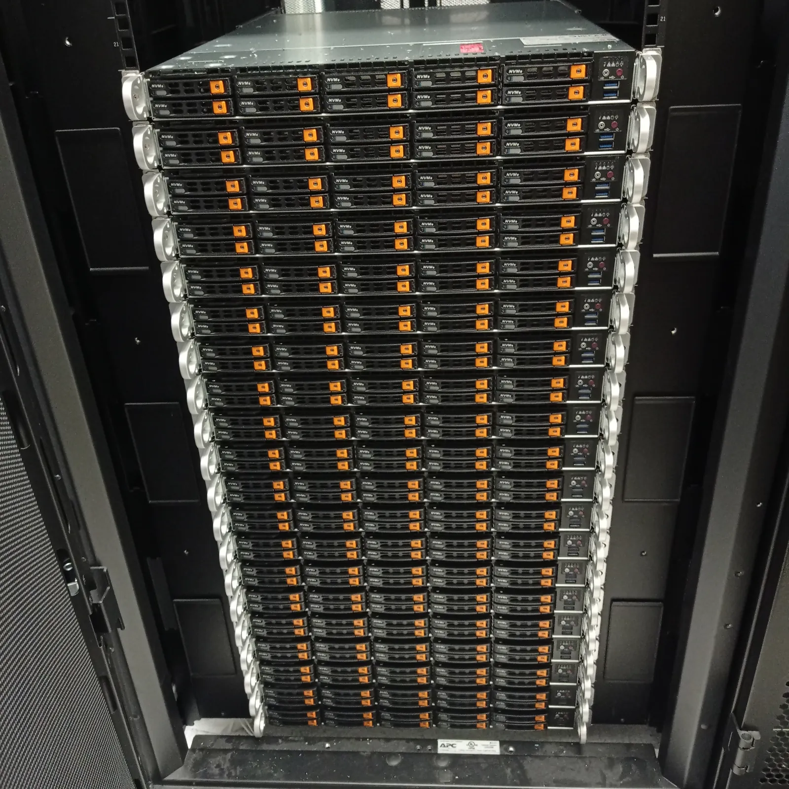 Rack-mounted storage array with rows of NVMe drive bays